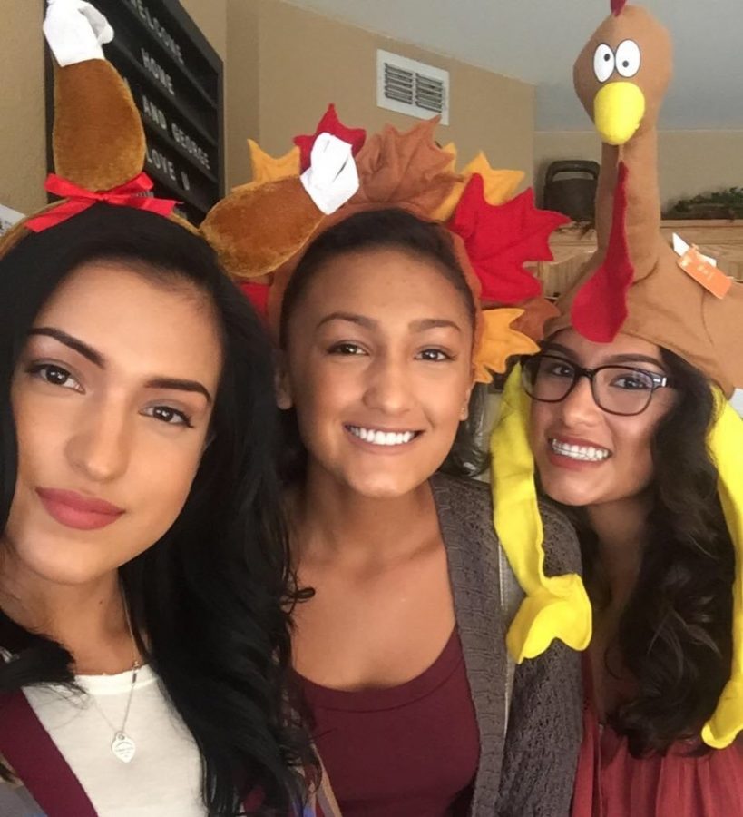 Mireya Tabasa and a couple of her sisters dressing up for Thanksgiving