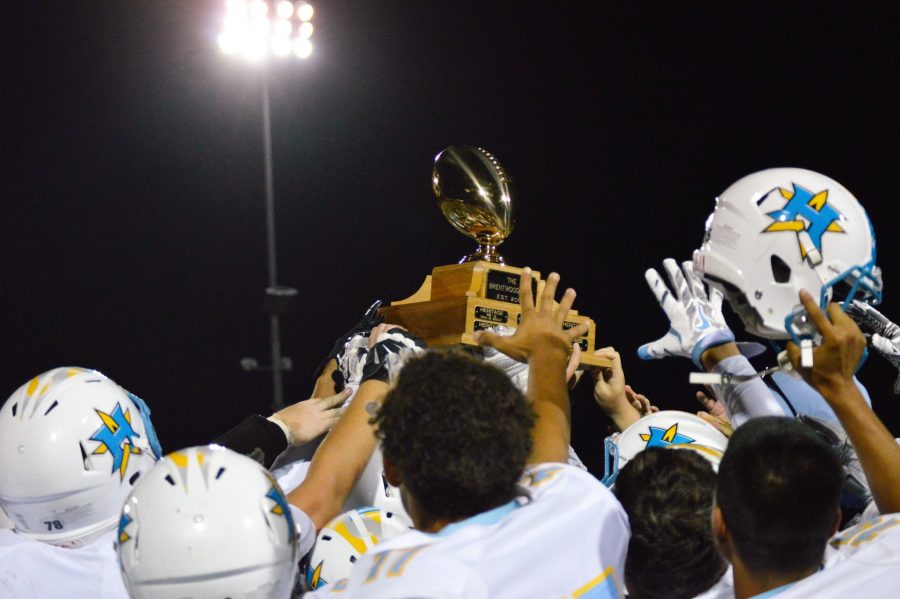 Heritages Varsity team hold up the Brentwood Bowl trophy and hold the Brentwood title once again.