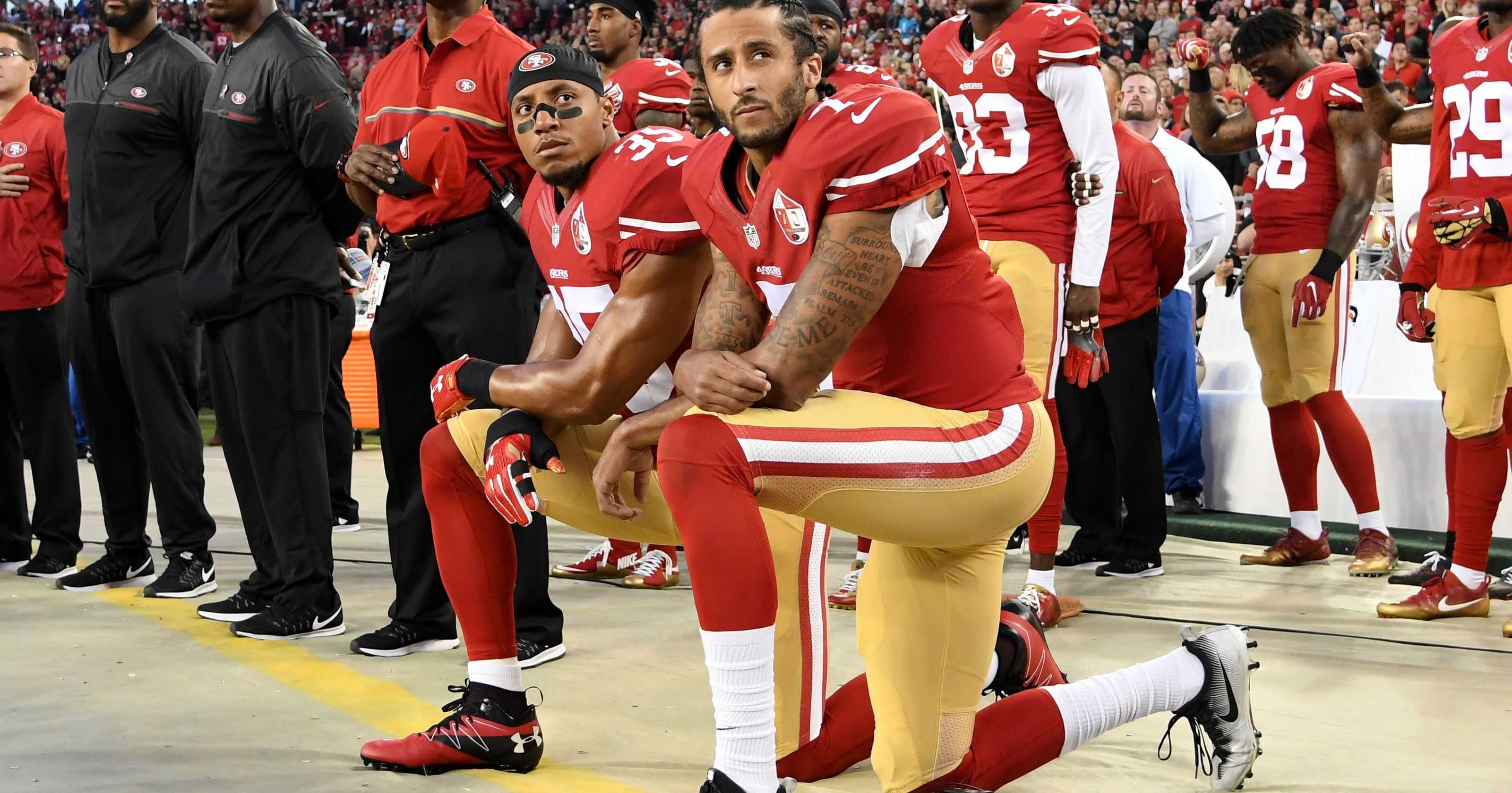 Colin Kaepernick kneeling alongside Eric Reid during the National Anthem.