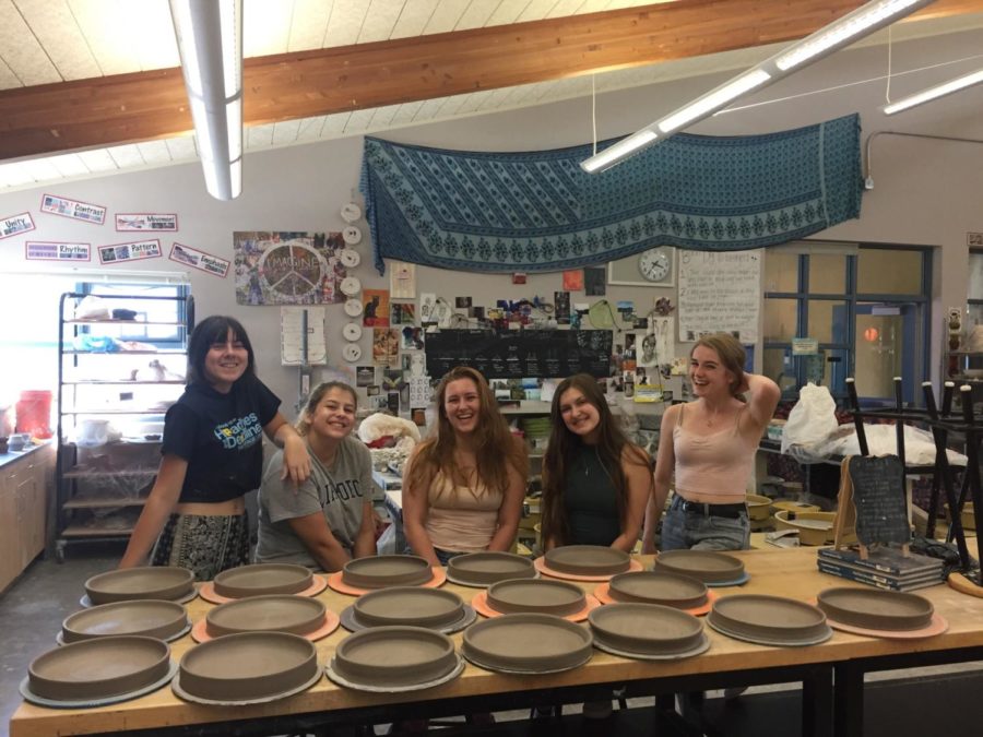 The HHS Clay Club officers in the midst of making all the plates. Photo taken by: Mrs. Shokrai