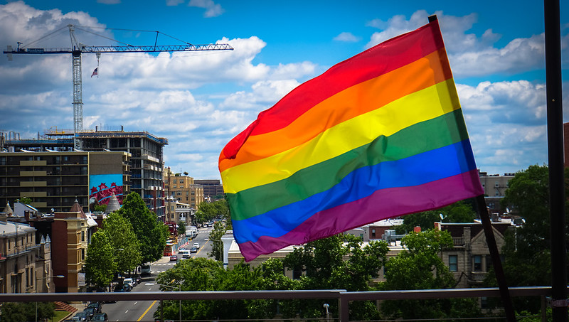 2017.07.02 Rainbow and US Flags Flying Washington, DC USA 7203 by tedeytan is licensed under CC BY-SA 2.0.